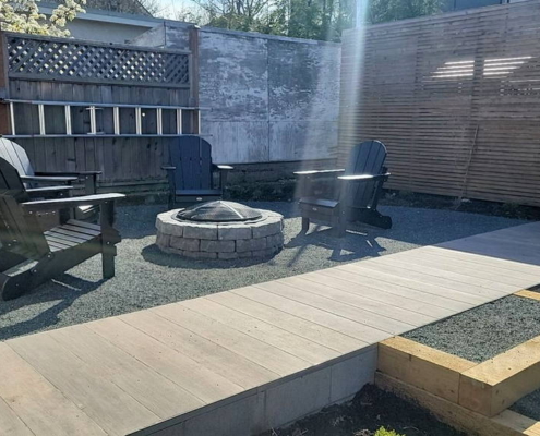 Backyard gravel and paver fire pit lounge complete
