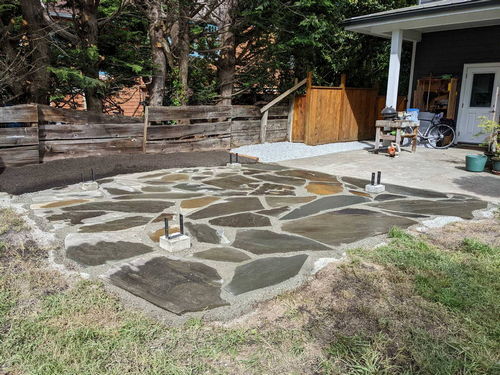 Flagstone patio installation after before pergola